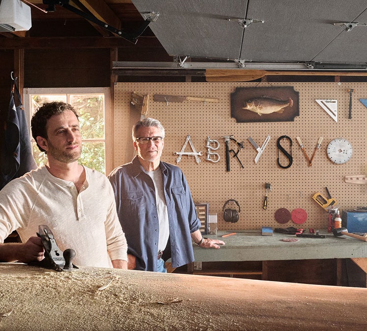 Adults in a garage with ABRYSVO® spelt out by tools, thinking about the name of an RSV vaccine for older adults.