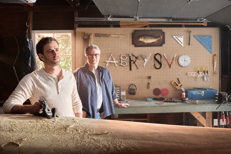Adults in a garage with ABRYSVO® spelt out by tools, thinking about the name of an RSV vaccine for older adults.