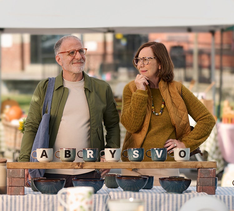 Older adults with ABRYSVO® display, highlighting RSV vaccination awareness.